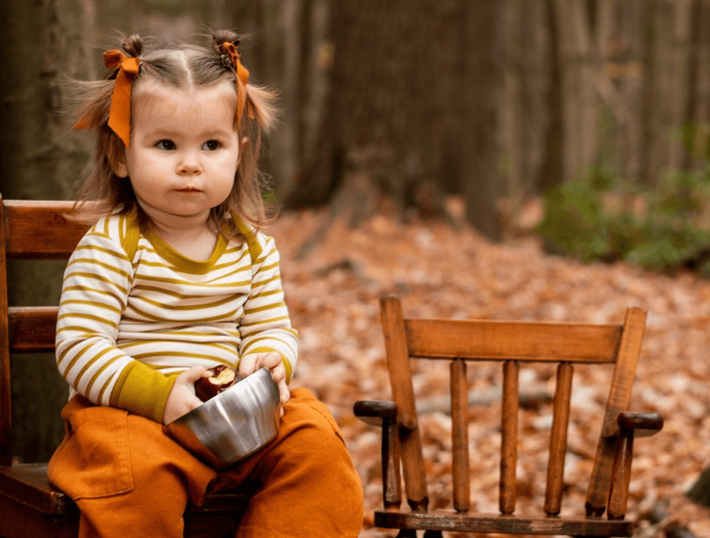 Toddler wearing West Rock Apparel, featuring a yellow striped shirt and orange pants.